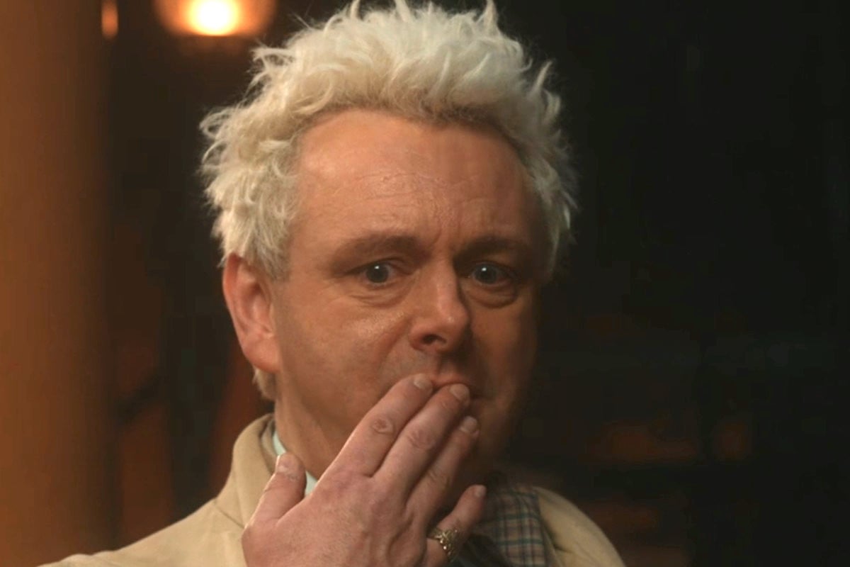 Aziraphale holds his fingers over his mouth, looking distraught.