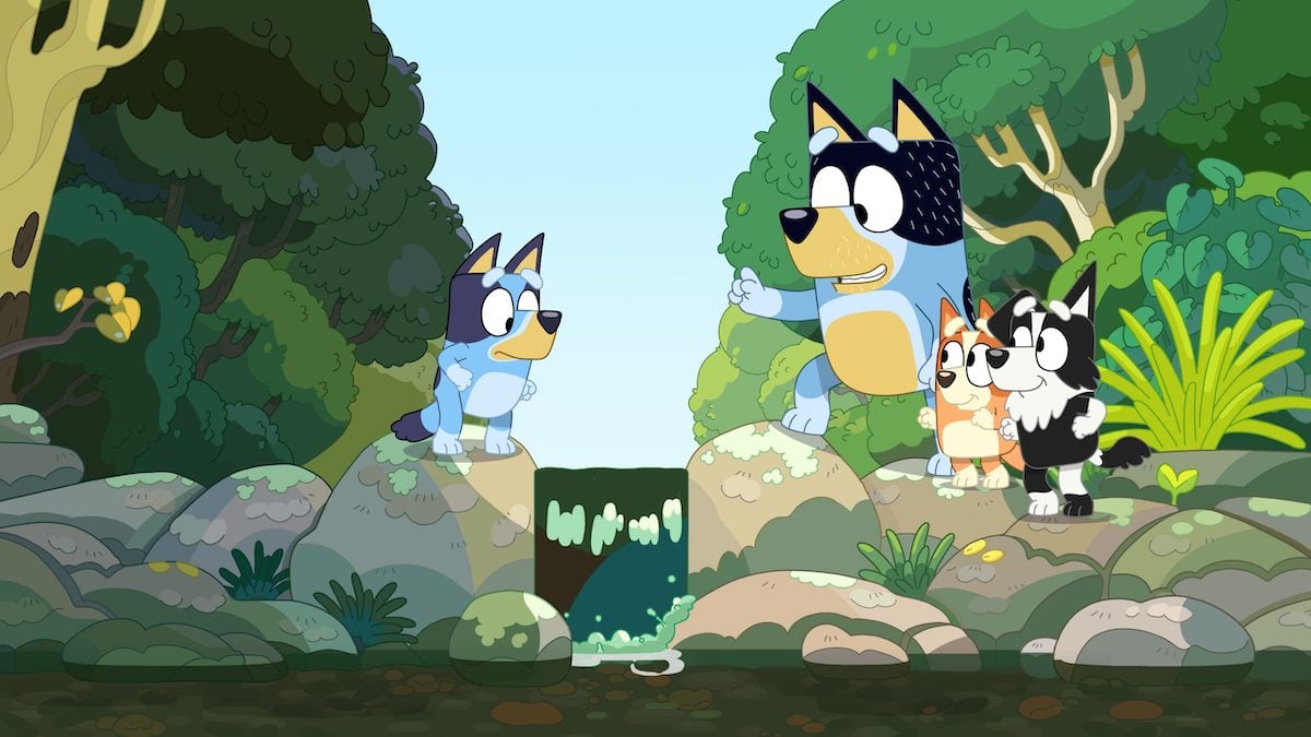 Bluey reluctantly crosses the creek, with Bandit, Bingo, and Mackenzie on the other side.