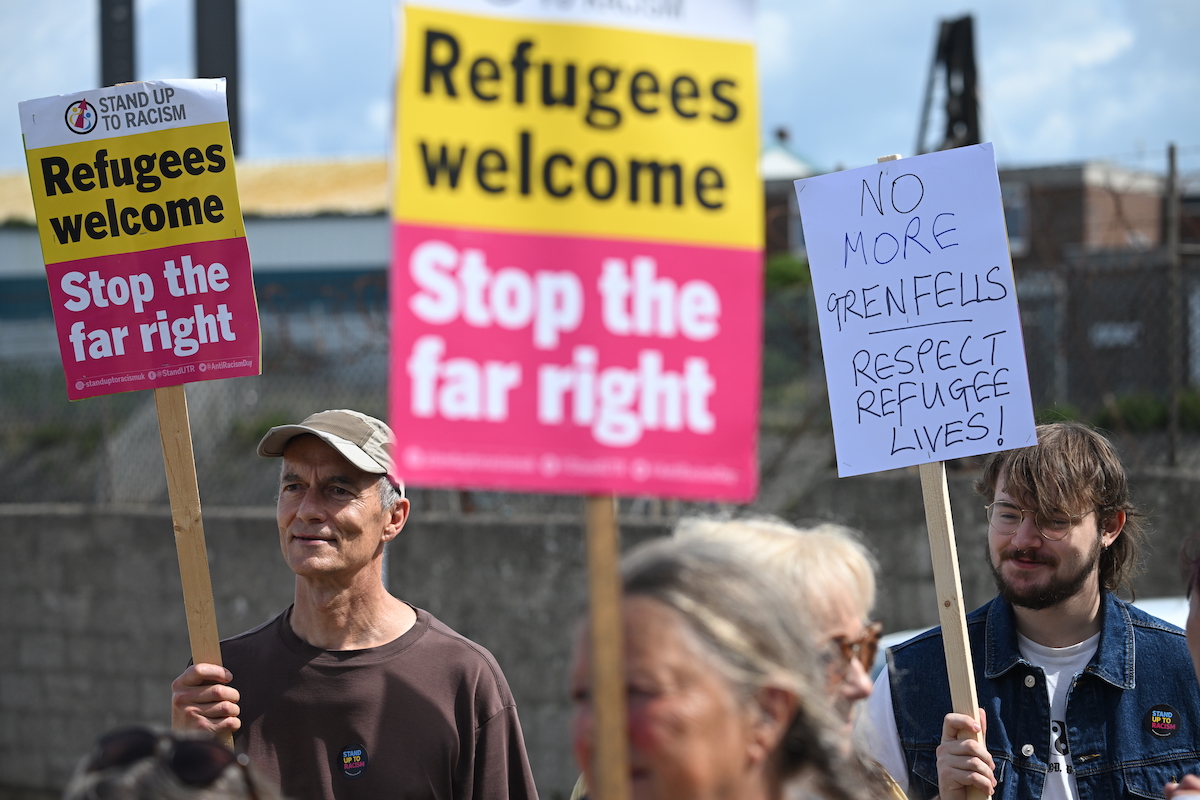 Protesters rally in support of refugees' rights.
