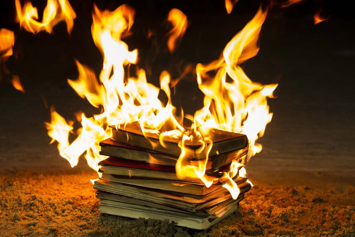 A pile of books, engulfed in flames.