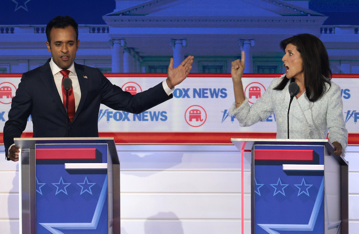 Republican presidential candidates, Vivek Ramaswamy (L) and former U.N. Ambassador Nikki Haley yell at each other during a debate.
