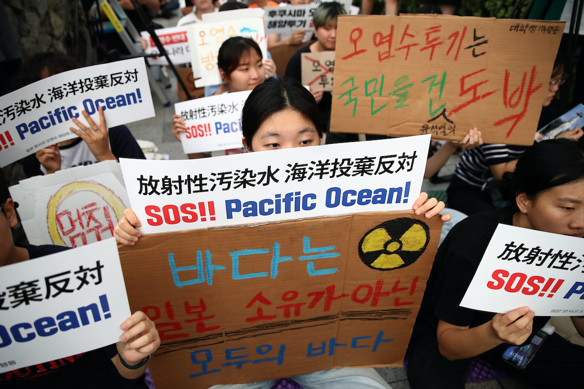 Protesters participate in a rally against the release of treated radioactive water