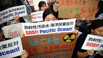 Protesters participate in a rally against the release of treated radioactive water