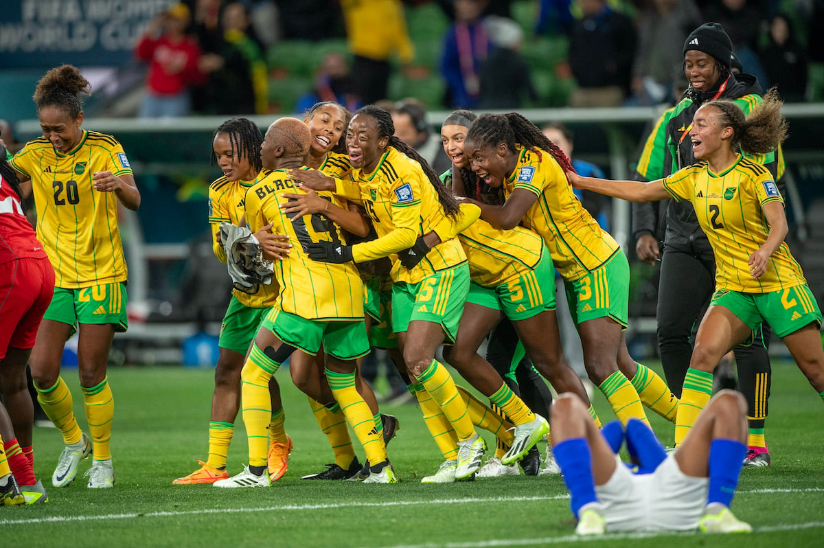 Jamaica's womens soccer players celebrate after a win.