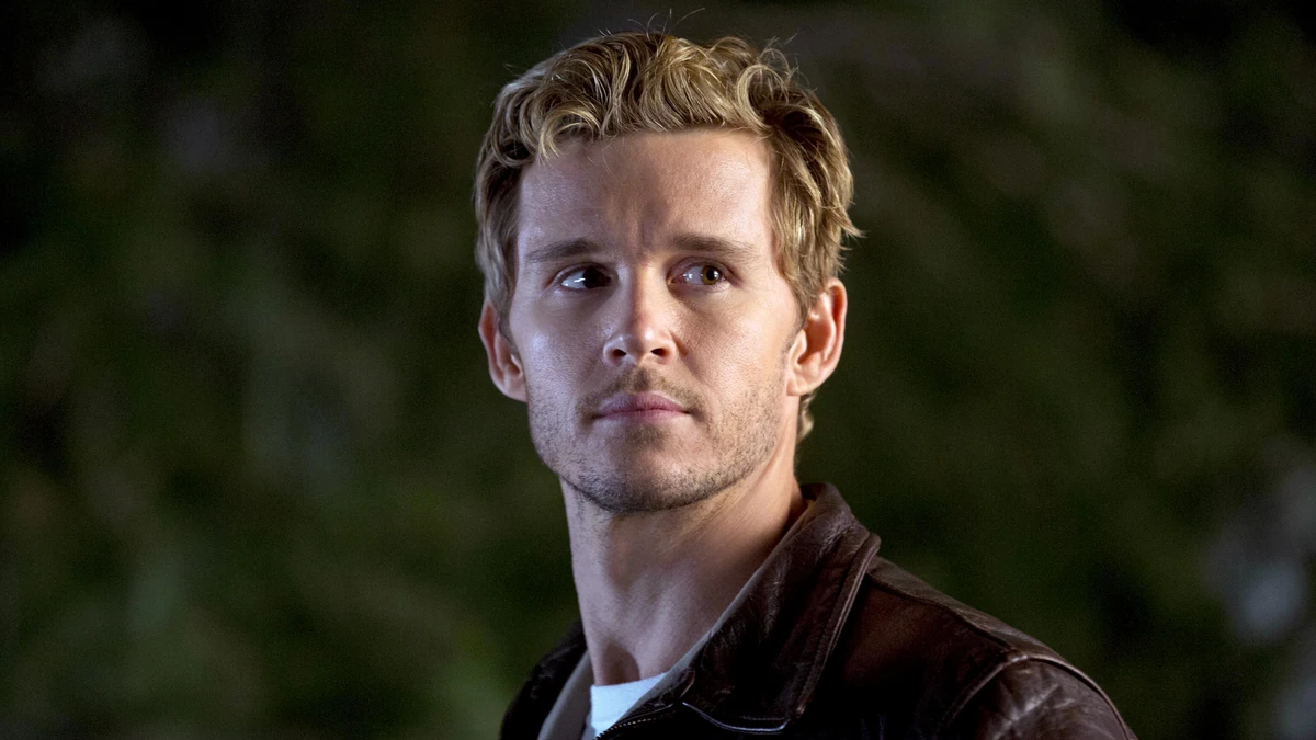 Jason Stackhouse in "True Blood" standing outside and looking off into the distance.