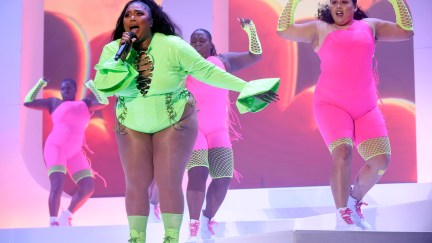 Lizzo performs in front of backup dancers.
