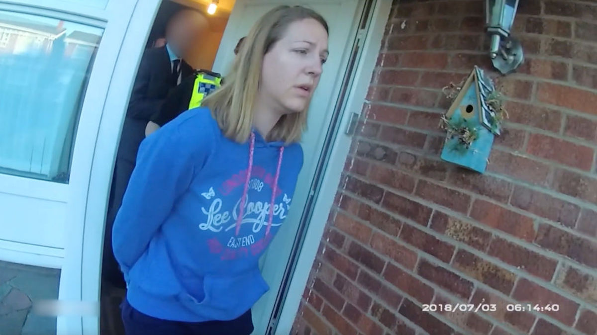Lucy Letby is led from her home by police.