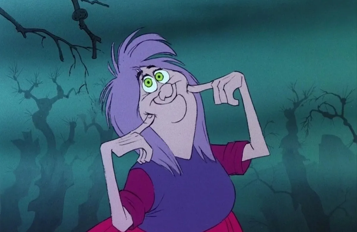 The animated character Madam Mim gives a fake innocent smile.