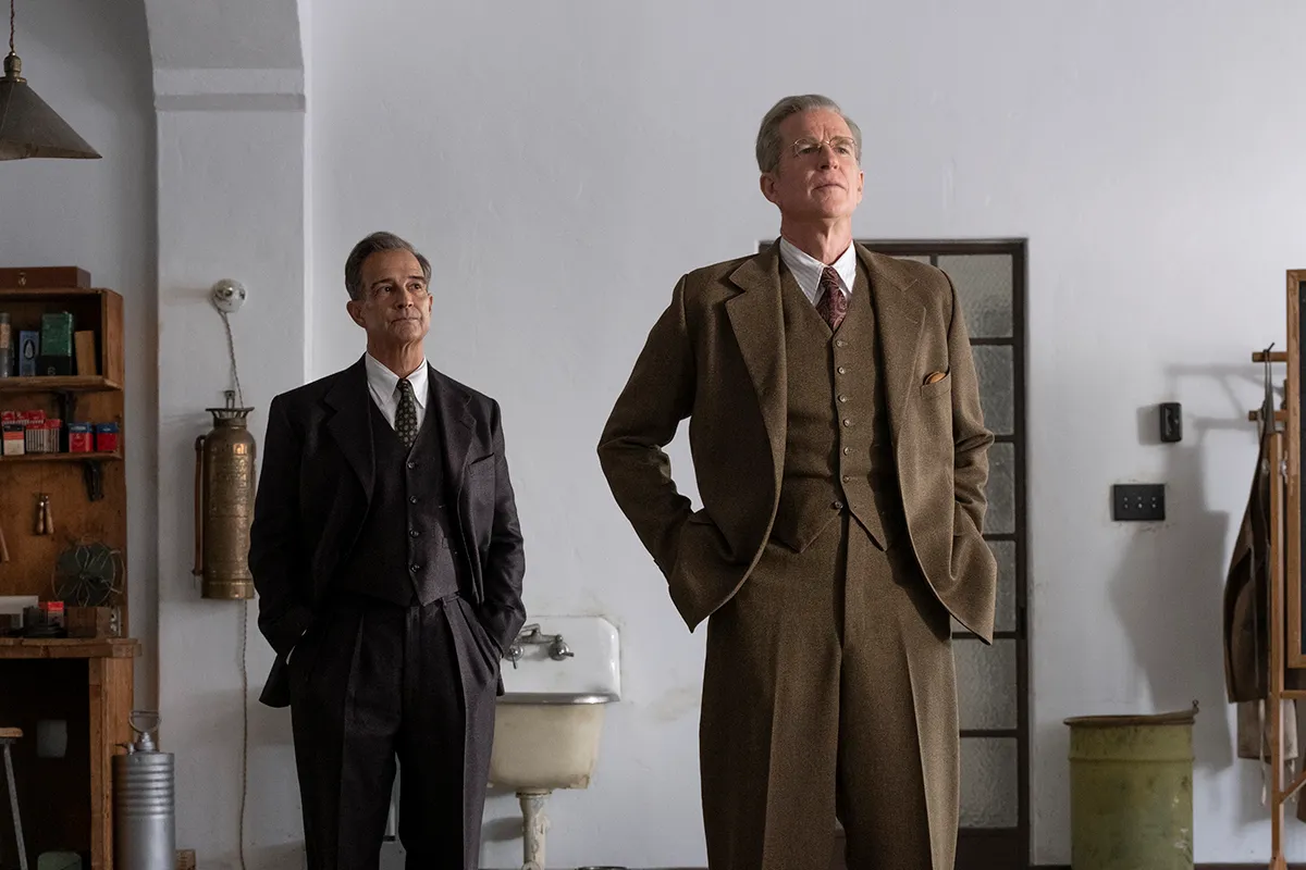 L to R: Tom Jenkins is Richard Tolman and Matthew Modine is Vannevar Bush in OPPENHEIMER, written, produced, and directed by Christopher Nolan.