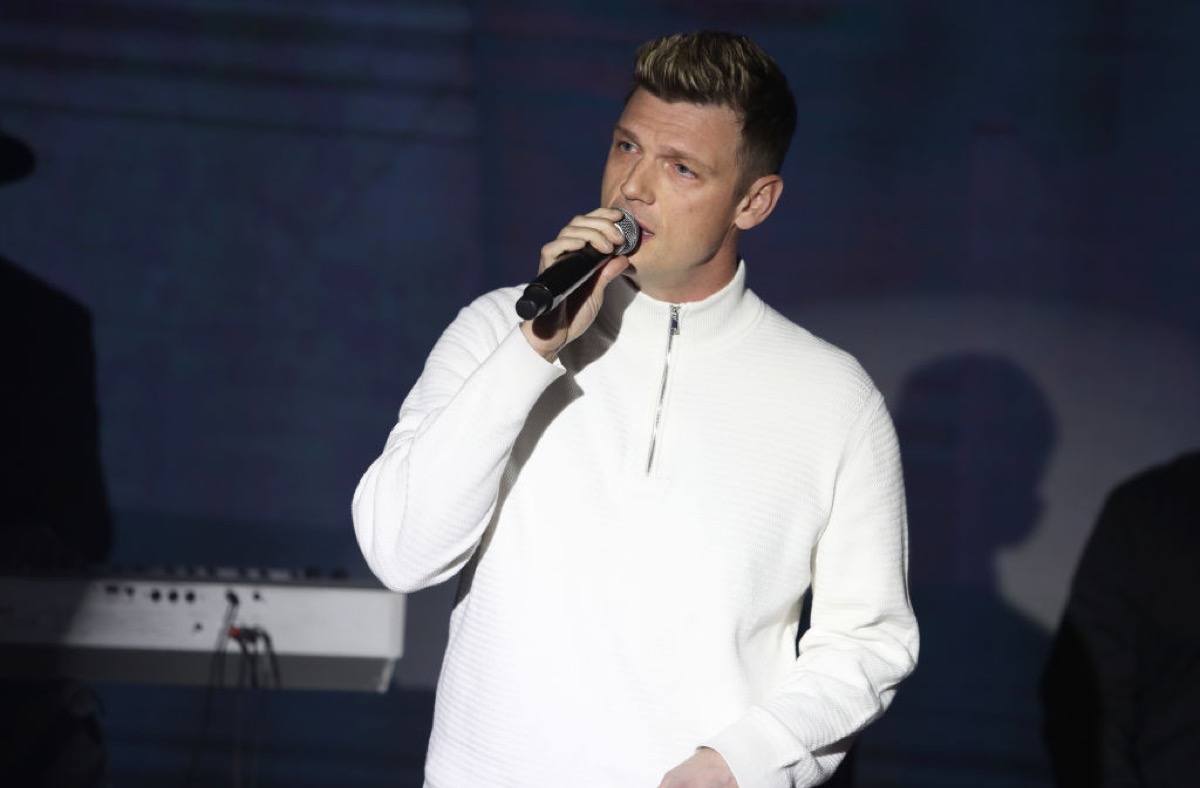 Nick Carter, singing into a microphone.