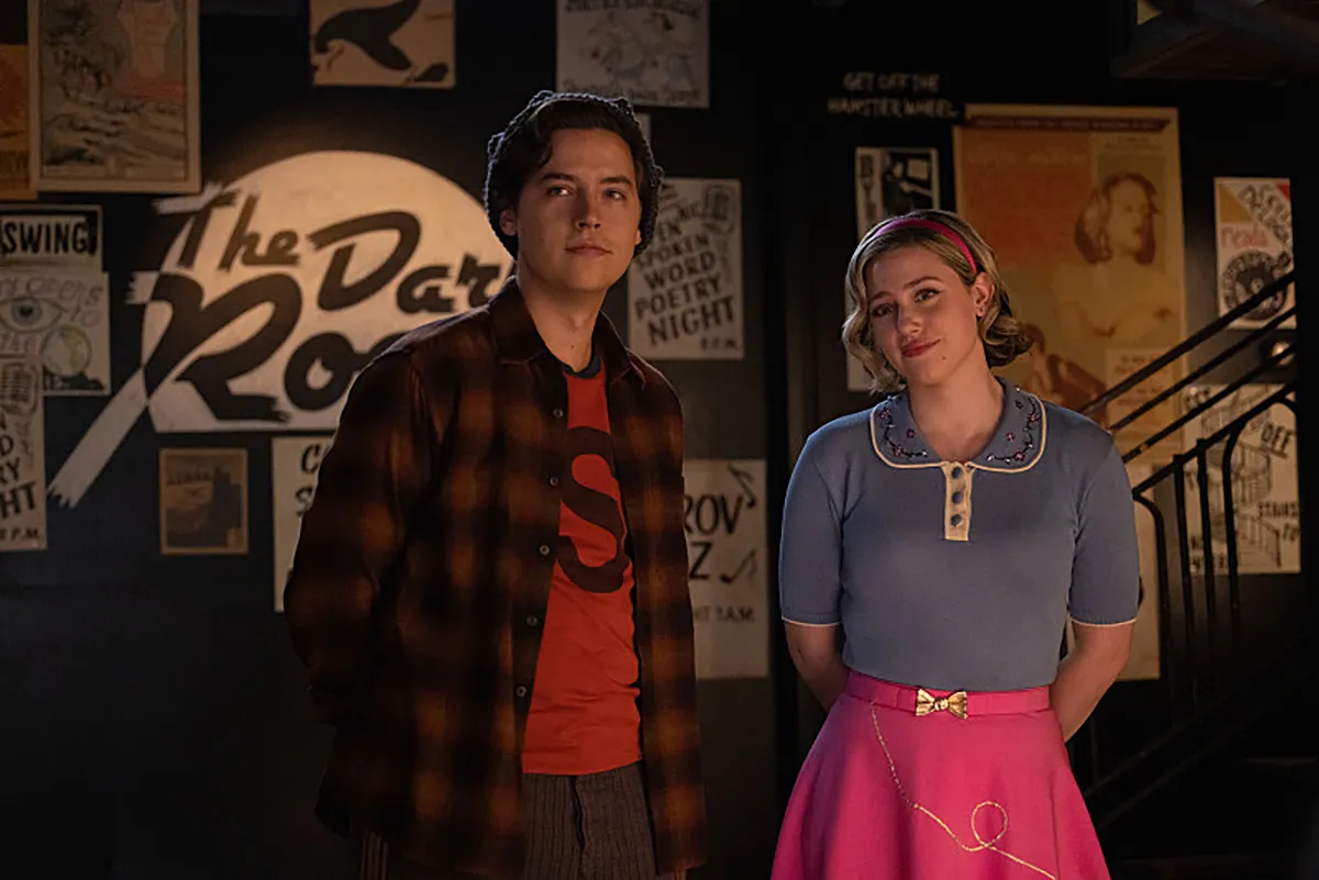 Riverdale -- “Chapter One Hundred Thirty-Seven: Goodbye, Riverdale” -- Image Number: RVD720c_0203r -- Pictured (L - R): Cole Sprouse as Jughead Jones and Lili Reinhart as Betty Cooper -- Photo: Justine Yeung/The CW -- © 2023 The CW Network, LLC. All Rights Reserved.