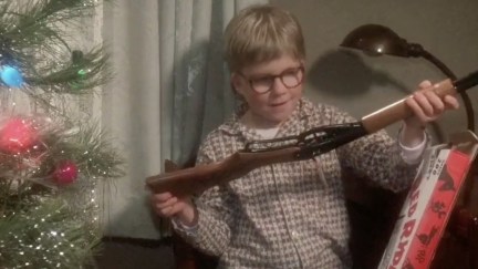 In a scene from A Christmas Story, a young boy (Raphie) marvels at a small rifle.