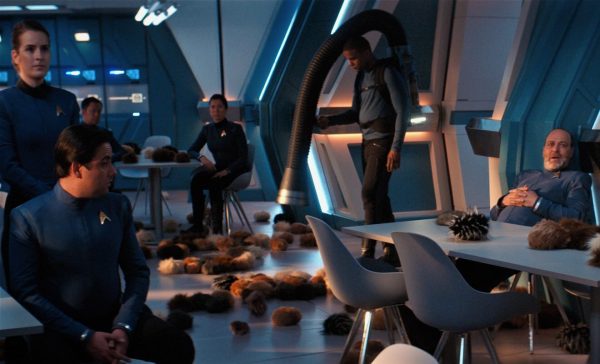a screenshot from the Star Trek: Short Treks episode "The Trouble with Edward" , where a janitor is cleaning up Tribbles.