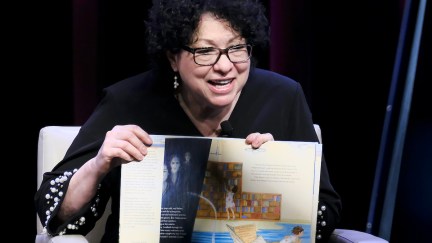 Supreme Court Justice Sonia Sotomayor reads from a children's book, showing the pictures.