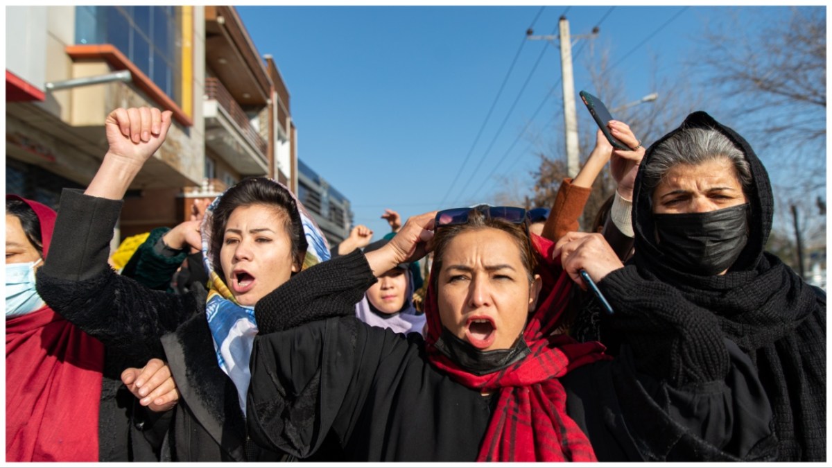 KABUL, AFGHANISTAN - DECEMBER 22: Afghan women protest against a new Taliban ban on women accessing University Education on December 22, 2022 in Kabul, Afghanistan. A group of Afghan women rallied in Kabul against a governmental order banning women from universities. Armed guards barred women from accessing university sites since the suspension was announced on December 20.
