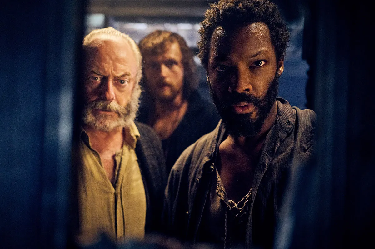 (from left) Captain Eliot (Liam Cunningham), Abrams (Chris Walley) and Clemens (Corey Hawkins) in The Last Voyage of the Demeter, directed by André Øvredal.