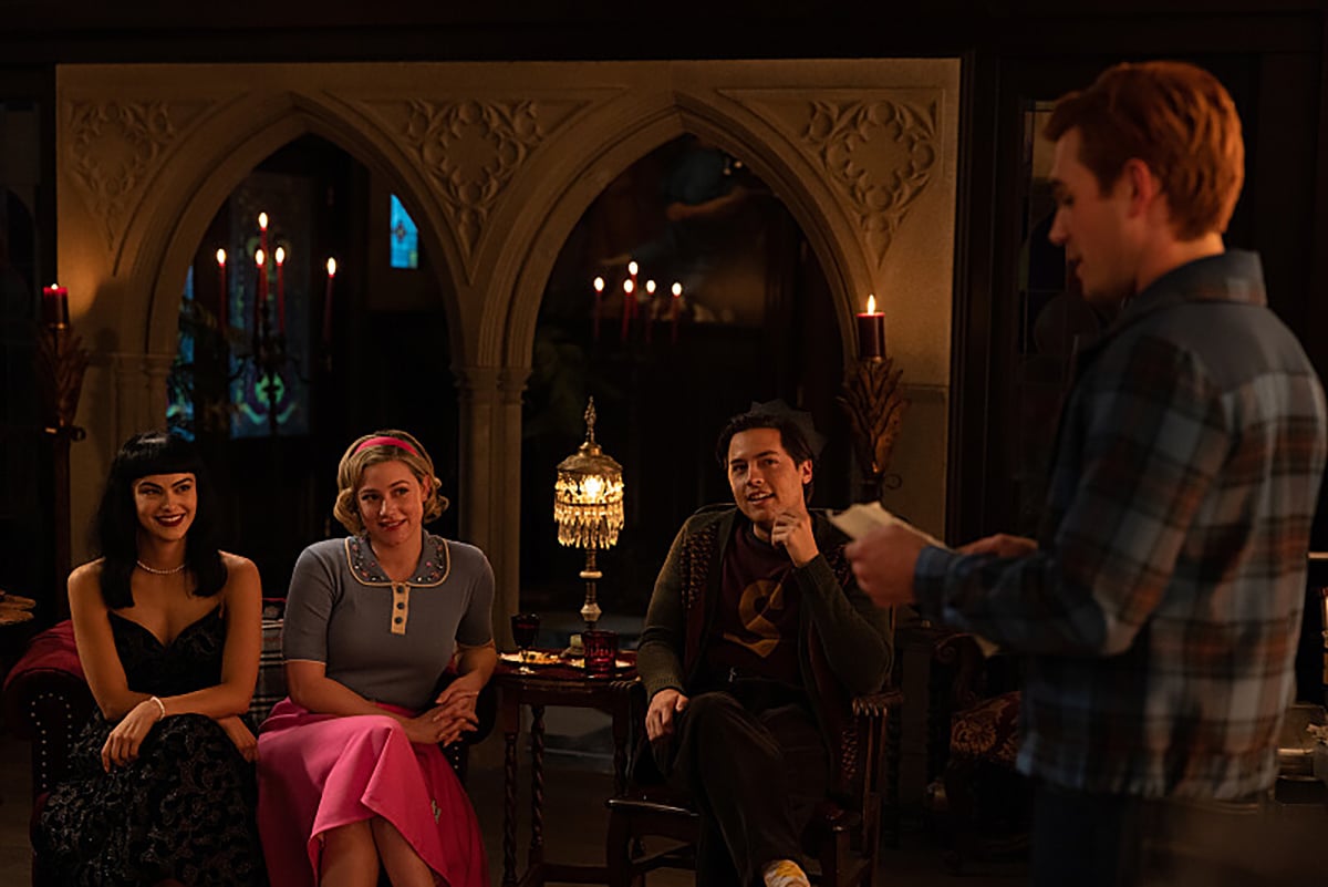Riverdale -- “Chapter One Hundred Thirty-Seven: Goodbye, Riverdale” -- Image Number: RVD720d_0180r -- Pictured (L - R): Camila Mendes as Veronica Lodge, Lili Reinhart as Betty Cooper, Cole Sprouse as Jughead Jones, and KJ Apa as Archie Andrews -- Photo: Justine Yeung/The CW -- © 2023 The CW Network, LLC. All Rights Reserved.