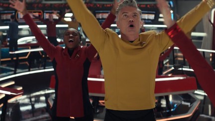 Captain Pike and the crew of the Enterprise sing and dance in the musical 