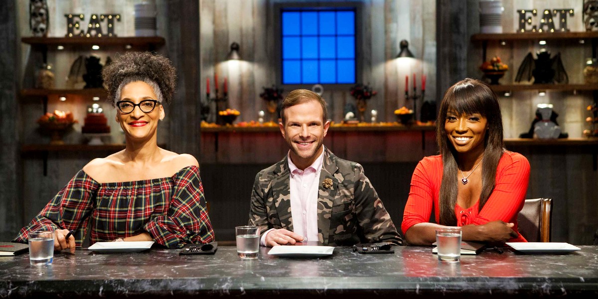 Carla Hall, Zac Young, and Lorraine Pascale serving as judges in Halloween Baking Championships