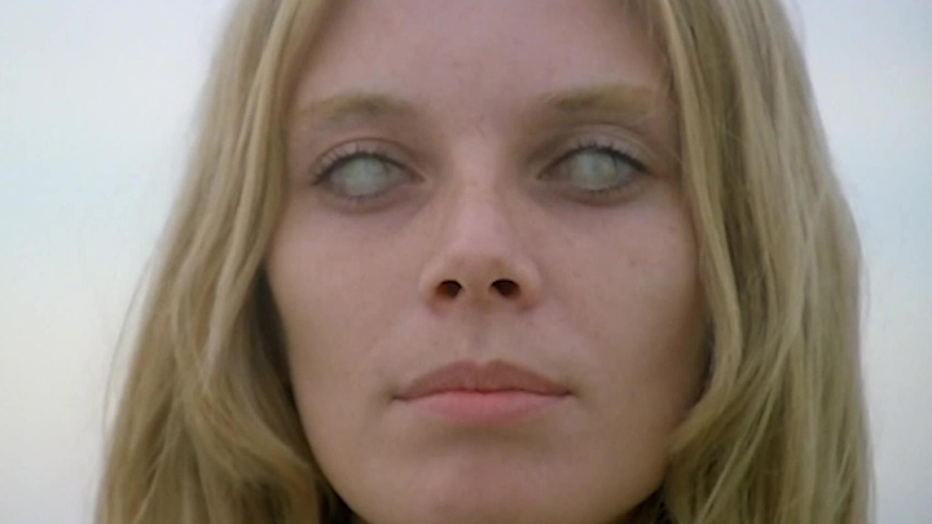 A blonde, blind woman (Cinzia Monreale) with milky eyes has premonitions in ‘The Beyond.’