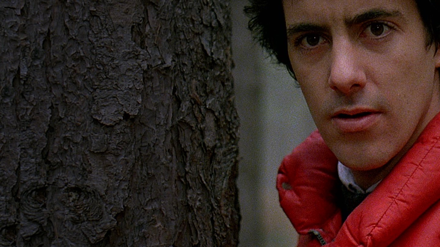 Dressed in a bright red parka jacket for chilly hiking along the English moors, (David Naughton) looks concerned in ‘An American Werewolf in London.’ 