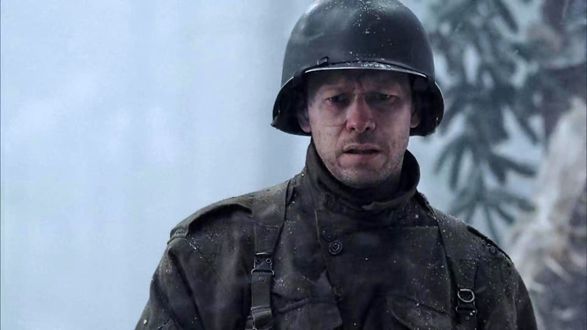 A soldier in World War II stands in the snow in 'Band of Brothers.'