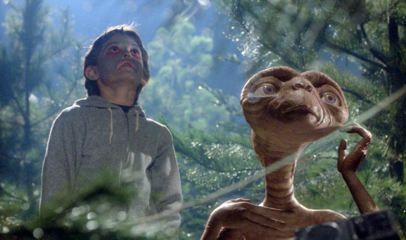 Henry Thomas as Elliot with E.T. in E.T. (Universal)
