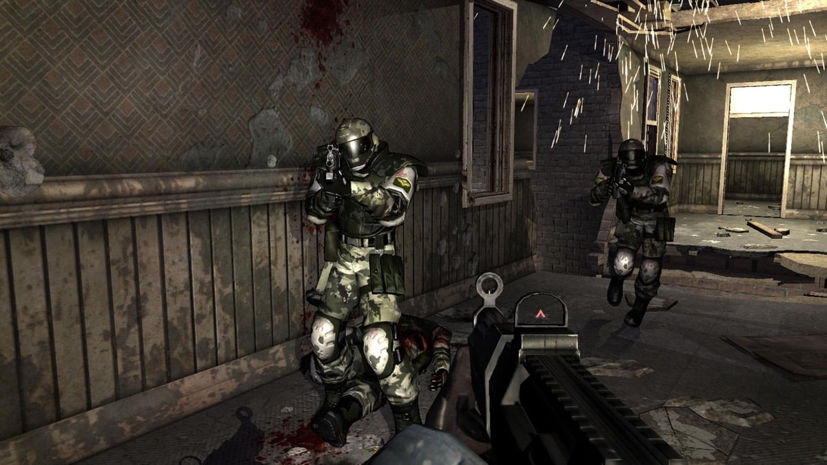 Soldiers stand in a bloodstained hallway in "F.E.A.R."