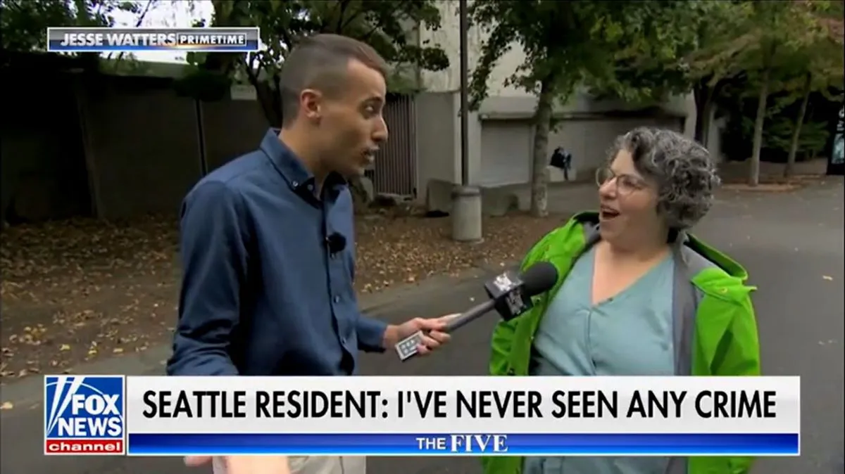 A Seattle resident looks incredulous while being interviewed by a Fox News reporter. The chyron reads, "Seattle resident: I've never seen any crime."