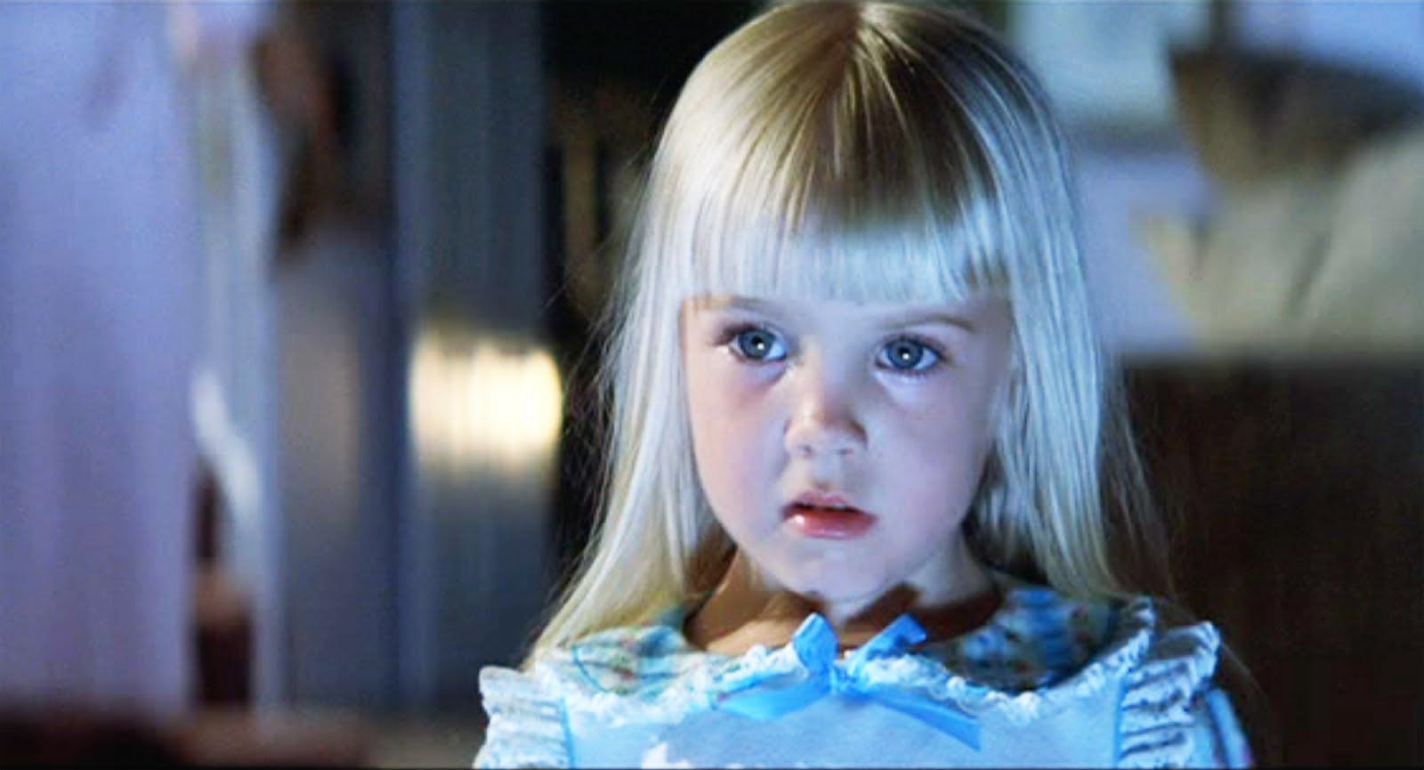  A blonde adolescent, Carol Anne Freeling (Heather O'Rourke) is transfixed by the glow of her family’s tv screen in ‘Poltergeist.’ 