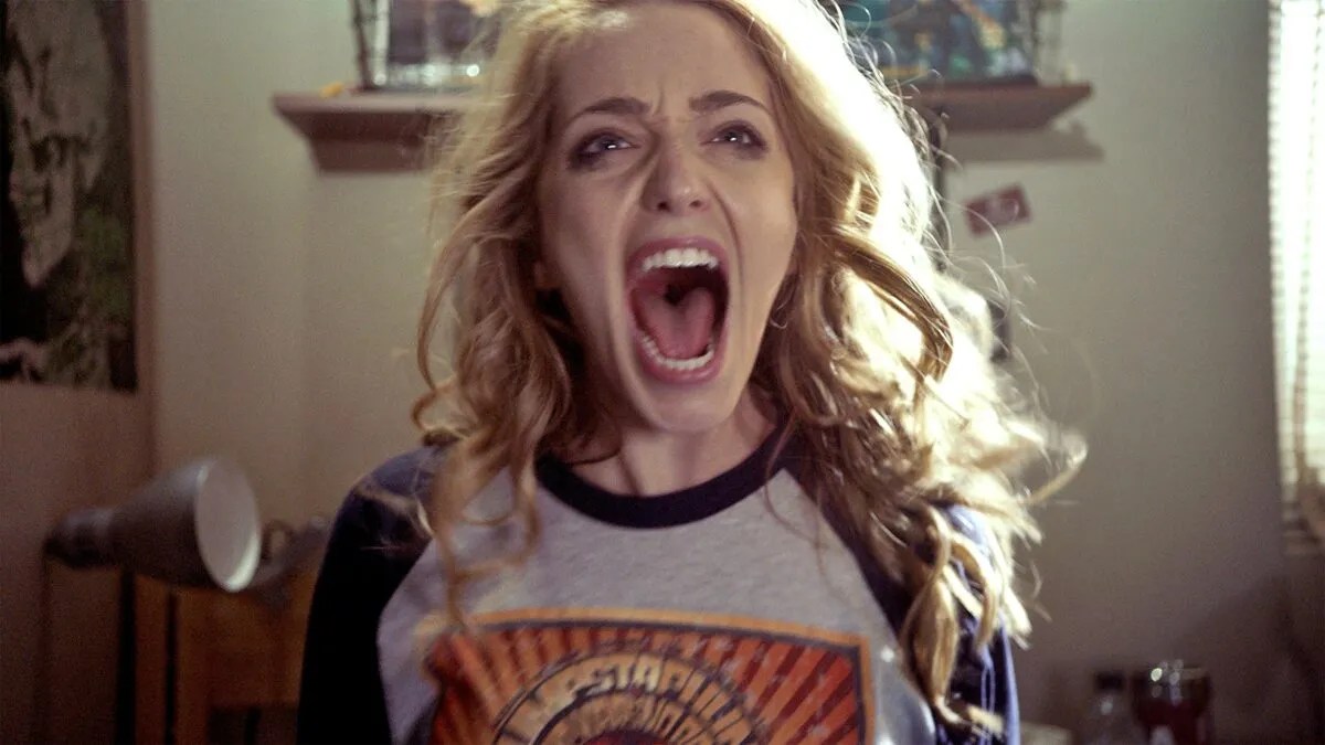 A bleary-eyed Theresa "Tree" Gelbman (Jessica Rothe) screams in ‘Happy Death Day.’ 