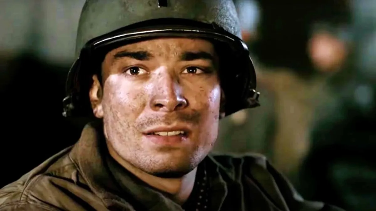 A soldier with a dirty face looks at the camera in 'Band of Brothers.'