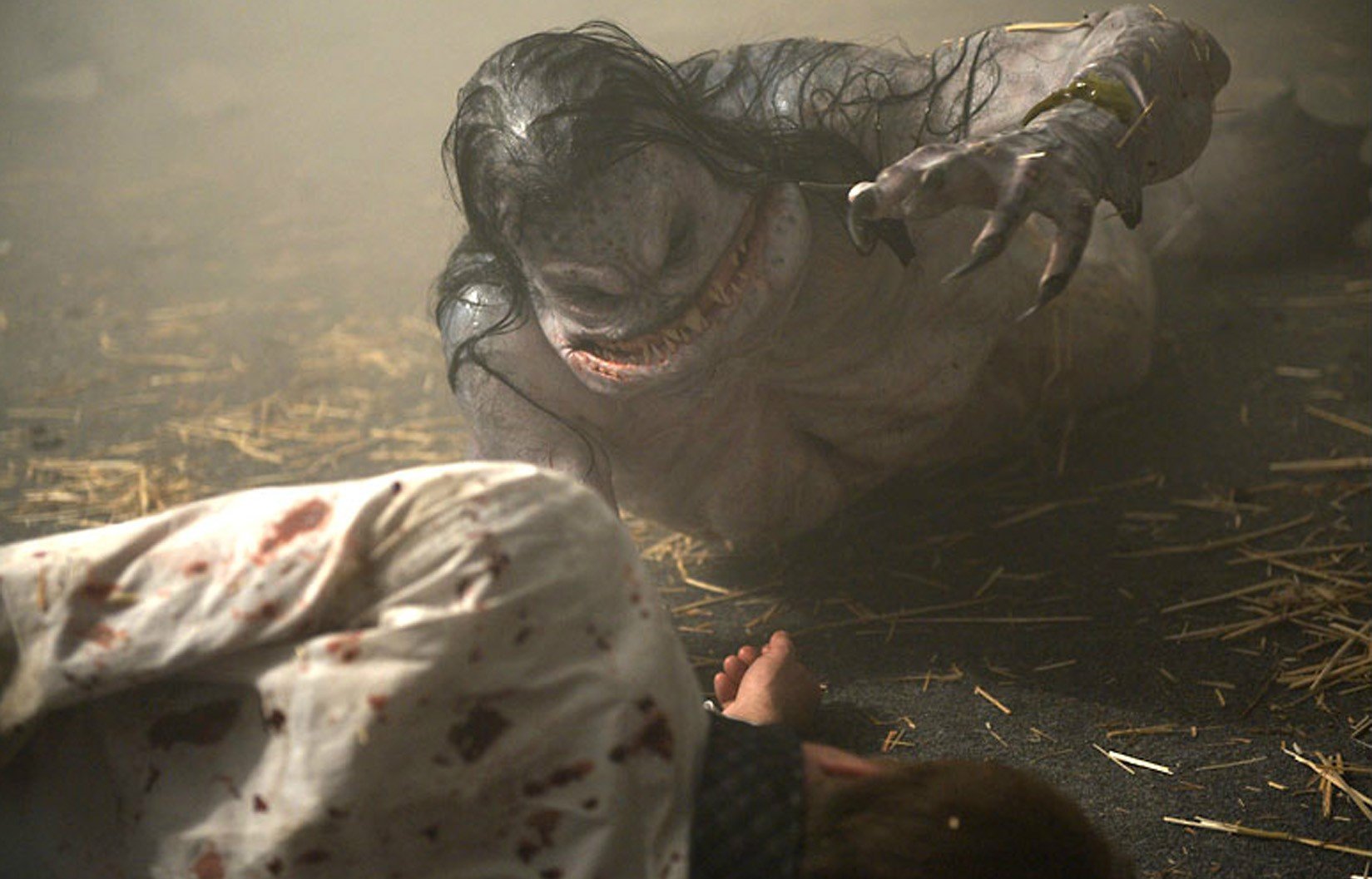 A wounded Facility technician is attacked by a Merman creature in ‘The Cabin in the Woods.’ 