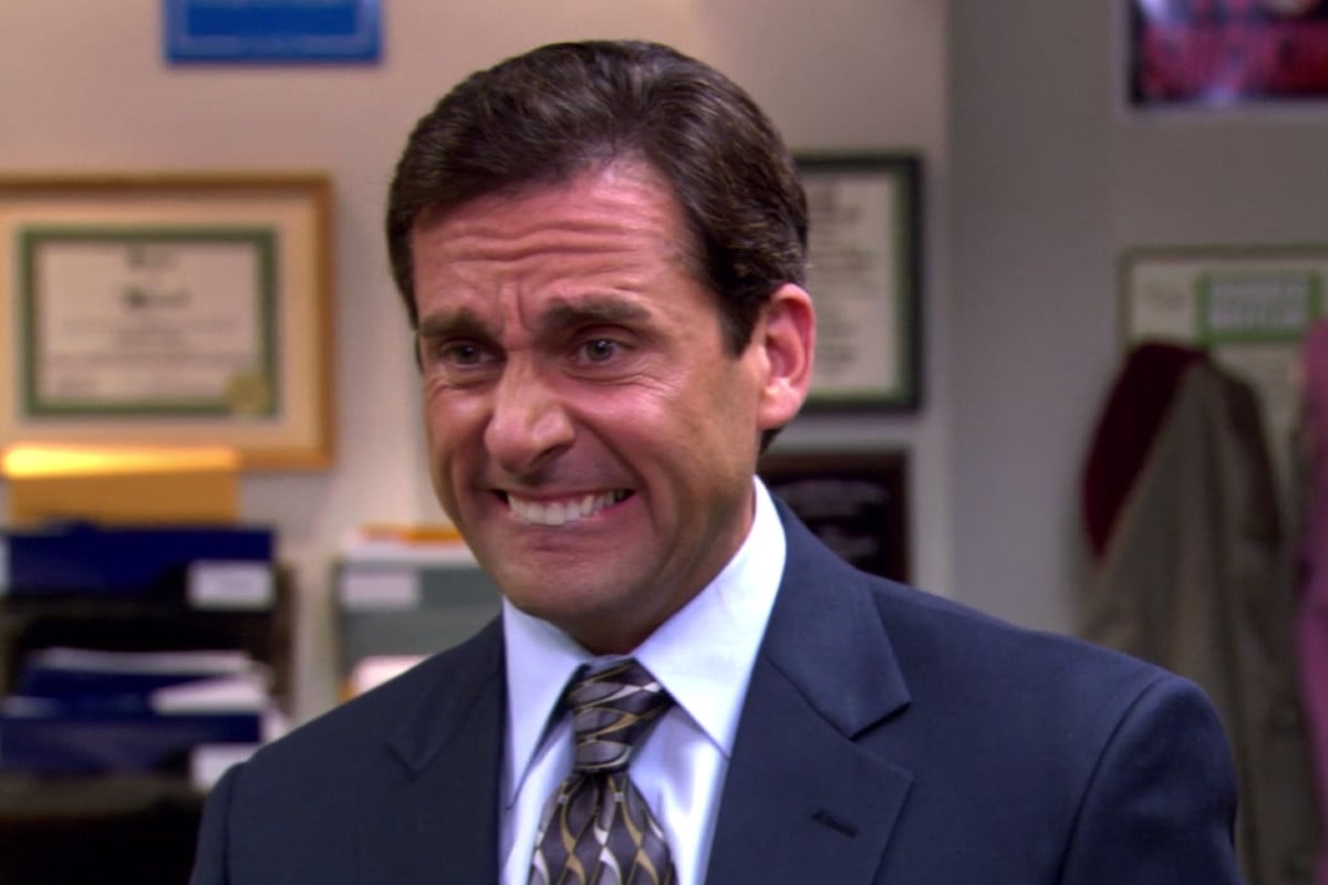 Michael Scott as portrayed by Steve Carrell grimacing in The Office