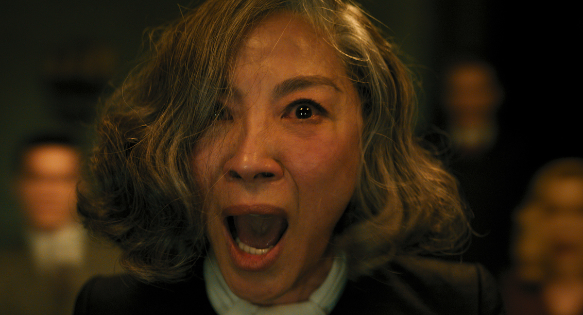 Michelle Yeoh yelling in close-up as Mrs. Reynolds