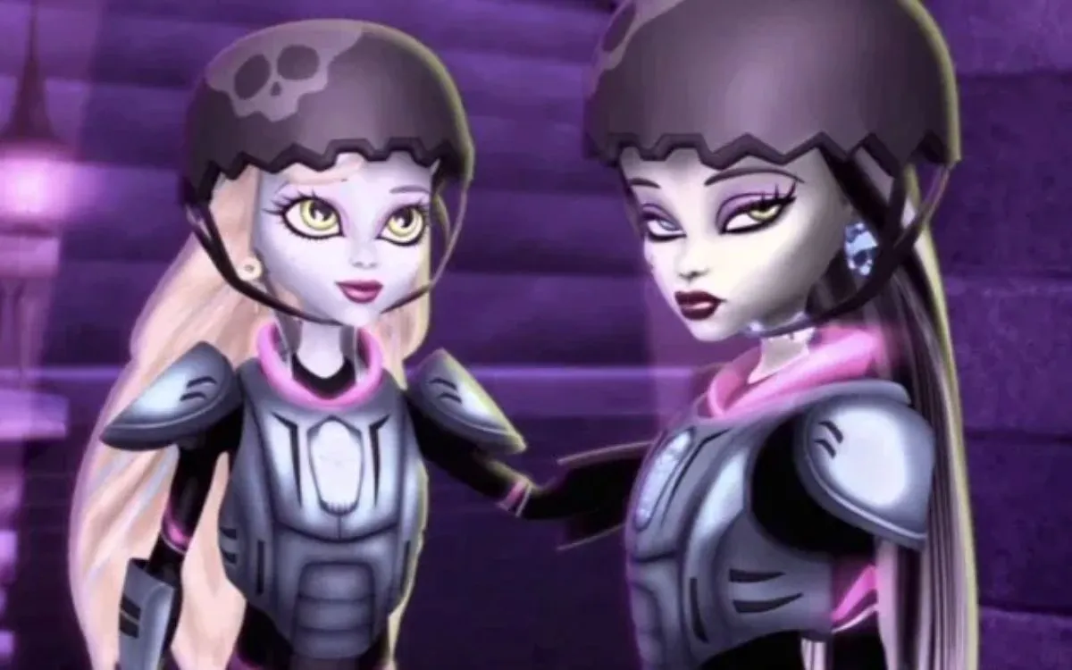 Monster High: Friday Night Frights; Laguna Blue and Draculaura half face each other and look toward the right. They're wearing black, football style padding, with black helmets with skull motifs.