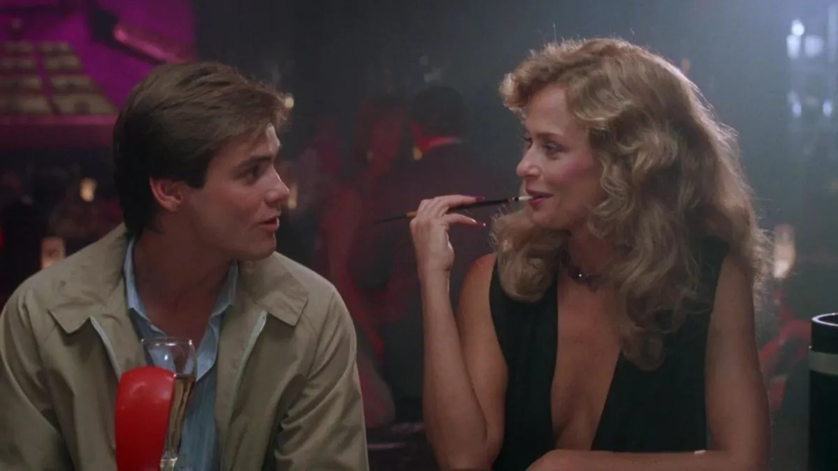 Jim Carrey and Lauren Hutton inside a bar in 'Once Bitten' 