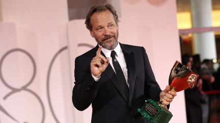 VENICE, ITALY - SEPTEMBER 09: Peter Sarsgaard poses with the Best Actor Award for 'Memory' at the winner's photocall at the 80th Venice International Film Festival on September 09, 2023 in Venice, Italy. (Photo by Elisabetta A. Villa/Getty Images)
