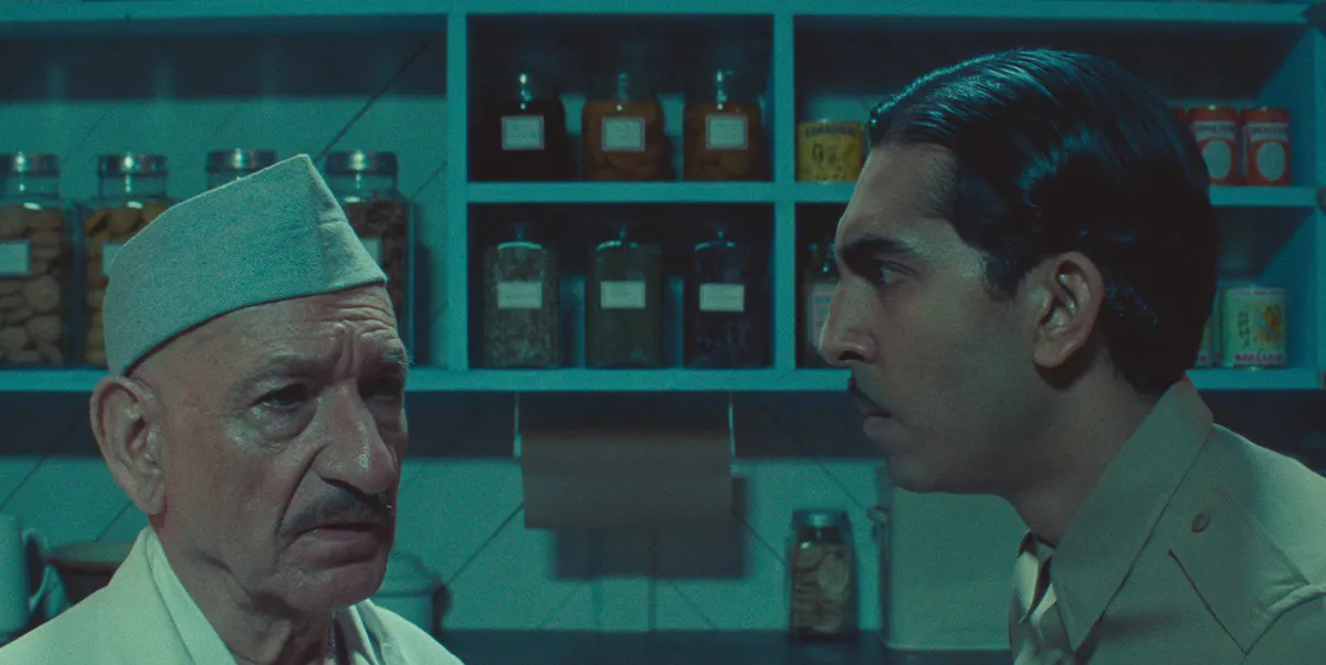 Poison. (L to R) Sir Ben Kingsley as Dr. Ganderbai and Dev Patel as Woods in Poison. Cr. Netflix ©2023