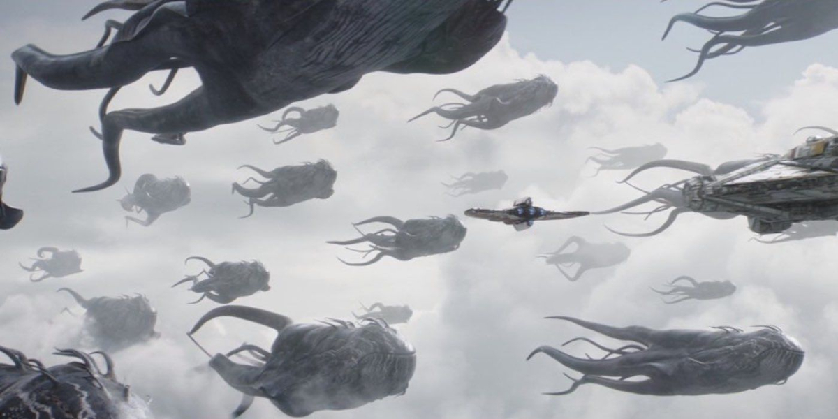 Space whales known as "purrgil" travel through the clouds alongside a ship in 'Ahsoka'