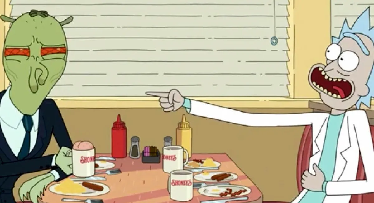 A cartoon man laughs and points at a disgruntled alien on "Rick and Morty."
