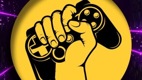 SAG-AFTRA graphic representing their Interactive Media (Video Game) contract. It is a yellow circle over a purple and black rectangular background. In the yellow circle is an illustration of a fist clutching a game controller.