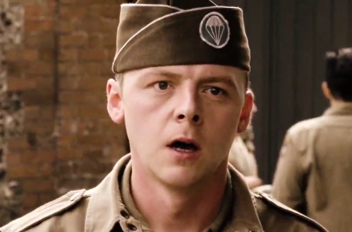A soldier wearing a paratrooper hat stands with his mouth open in 'Band of Brothers.'