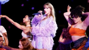 Taylor Swift performs with backup dancers at 'The Eras Tour'.