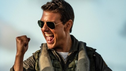 In a scene from Maverick, Tom Cruise pumps his fist.