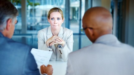 A woman looks unhappy in a job interview