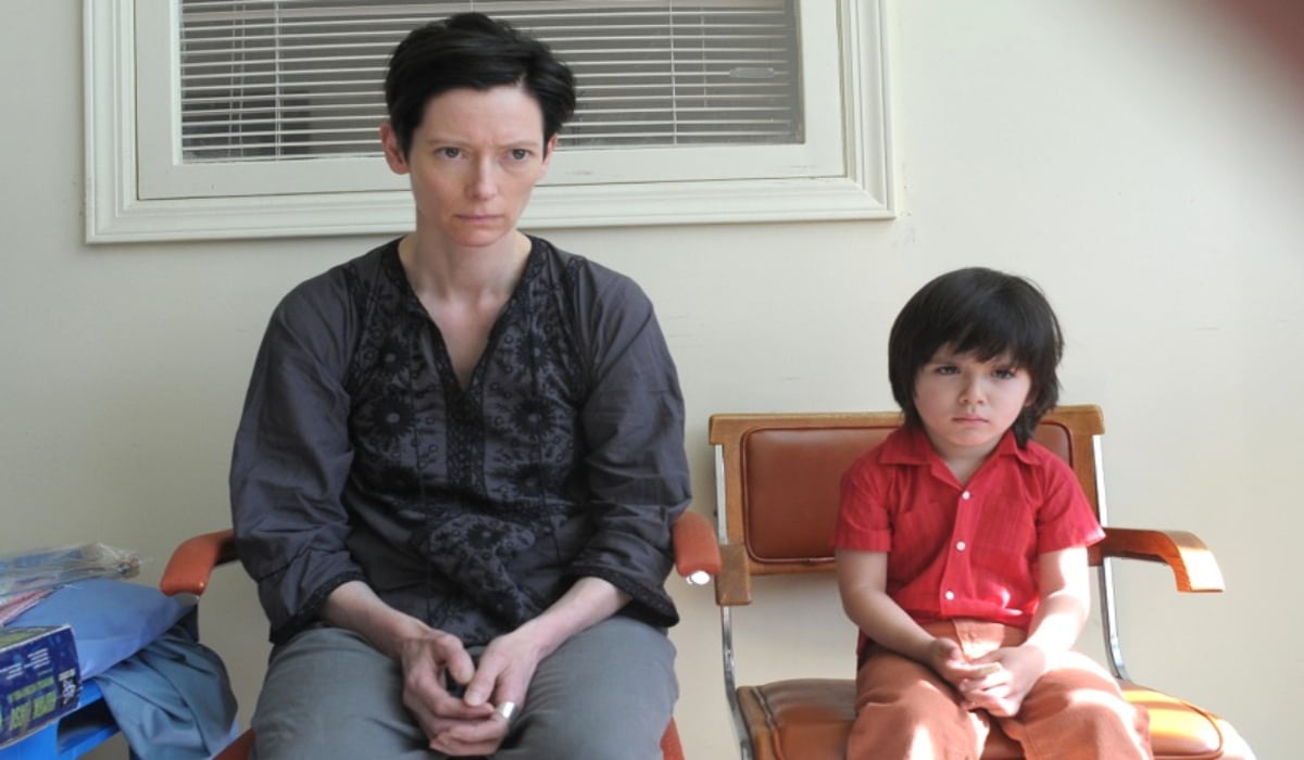 'We Need to Talk About Kevin' Tilda Swinton and young boy sitting down and looking eerie