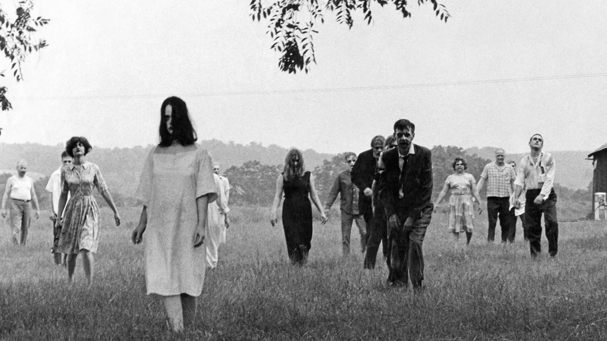 A horde of zombies shambling through a field in the black-and-white horror classic 'Night of the Living Dead'