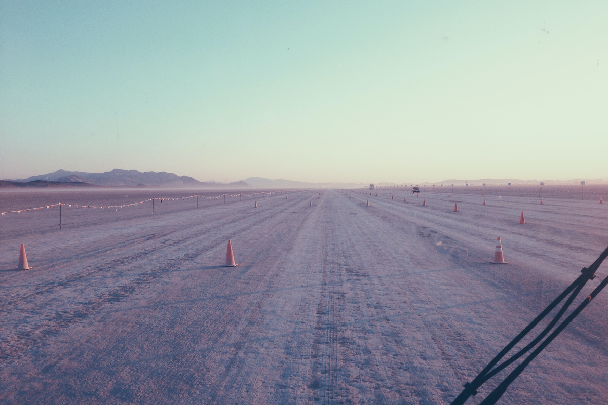 An eight-lane dirt road in the desert, leading to Burning Man.