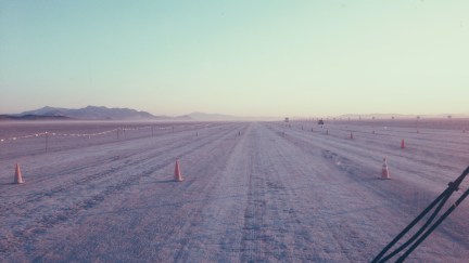 An eight-lane dirt road in the desert, leading to Burning Man.